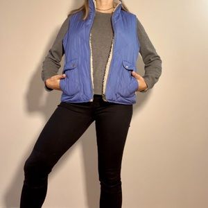 Light blue puffer vest. Reversible with fleece lining. Size small